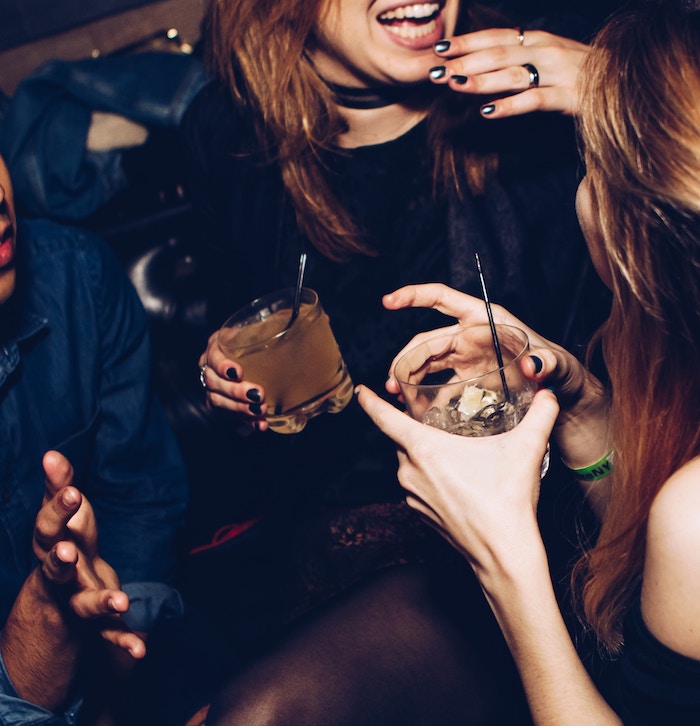 Girls laughing in a bar